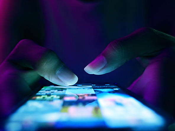 Person typing on phone